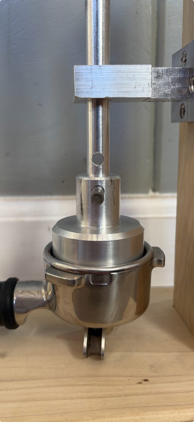 Close-up of the tamp head seated in the portafilter