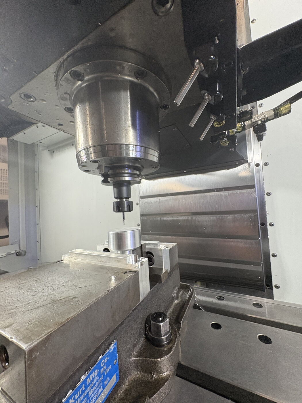 Close-up of the mill cutting a round pivot boss