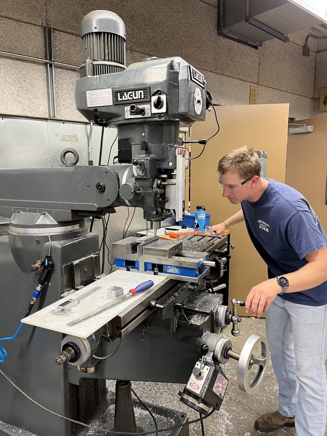 Josh operating a manual Lagun milling machine